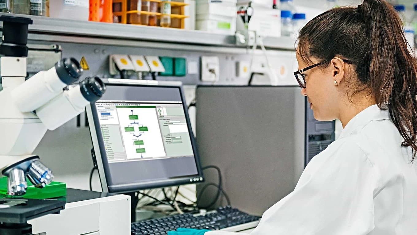 a woman working on PAS-X Electronic Batch Recording