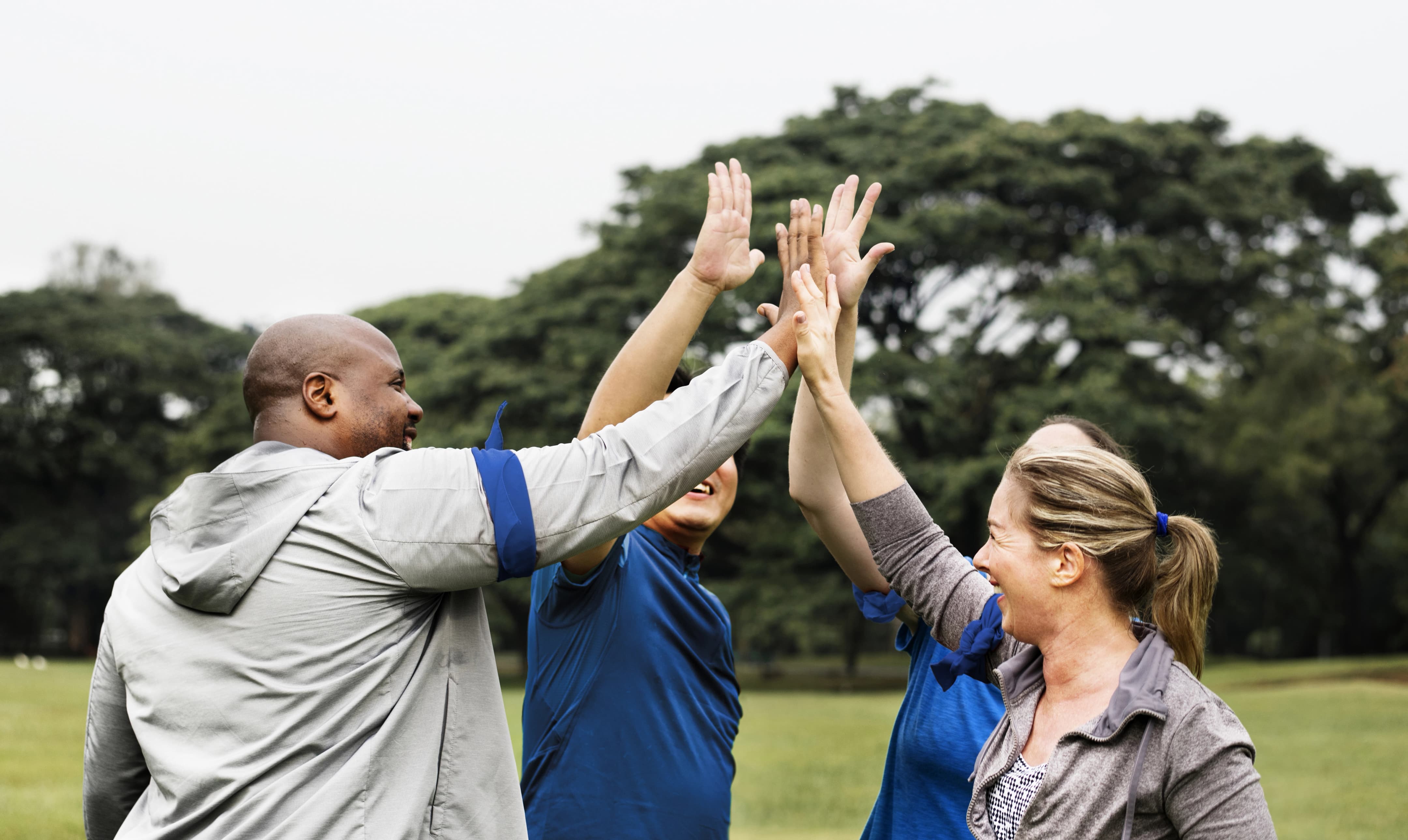 Körber employees doing an high-five