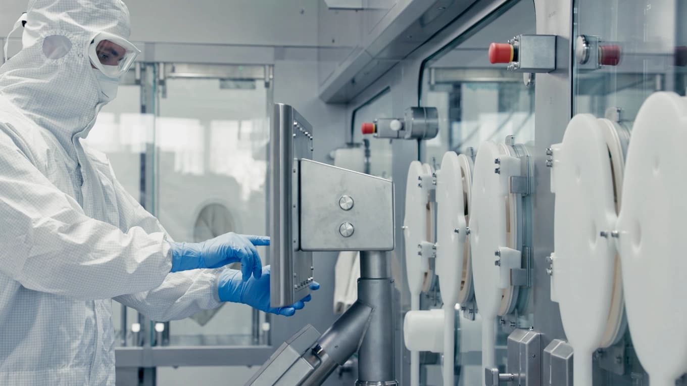 a man in safety gear working on a lab environment