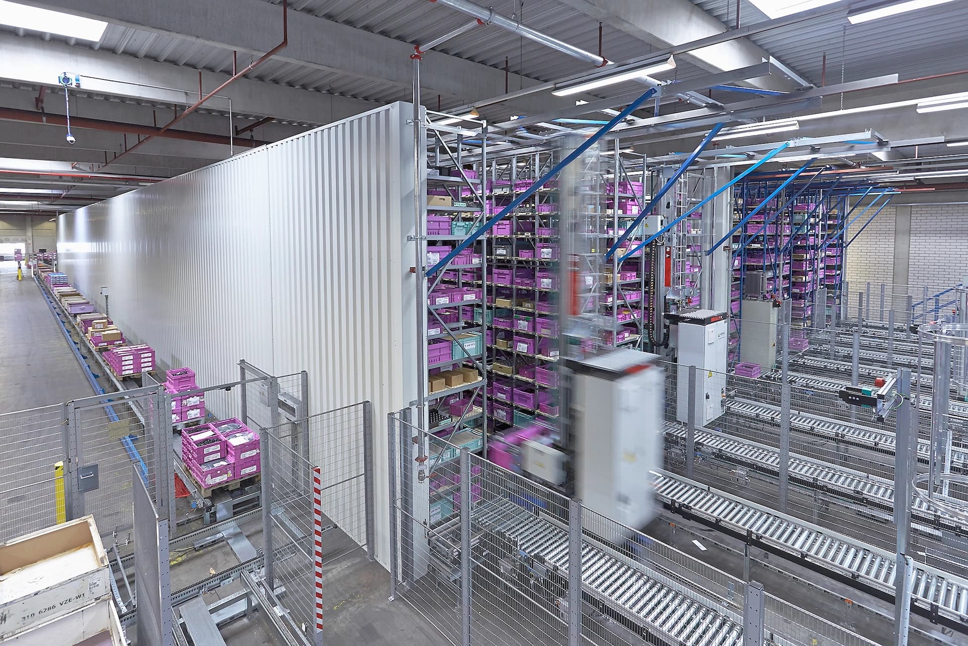 Schenker's warehouse filled with numerous shelves stacked with various items, showcasing an organized storage environment.