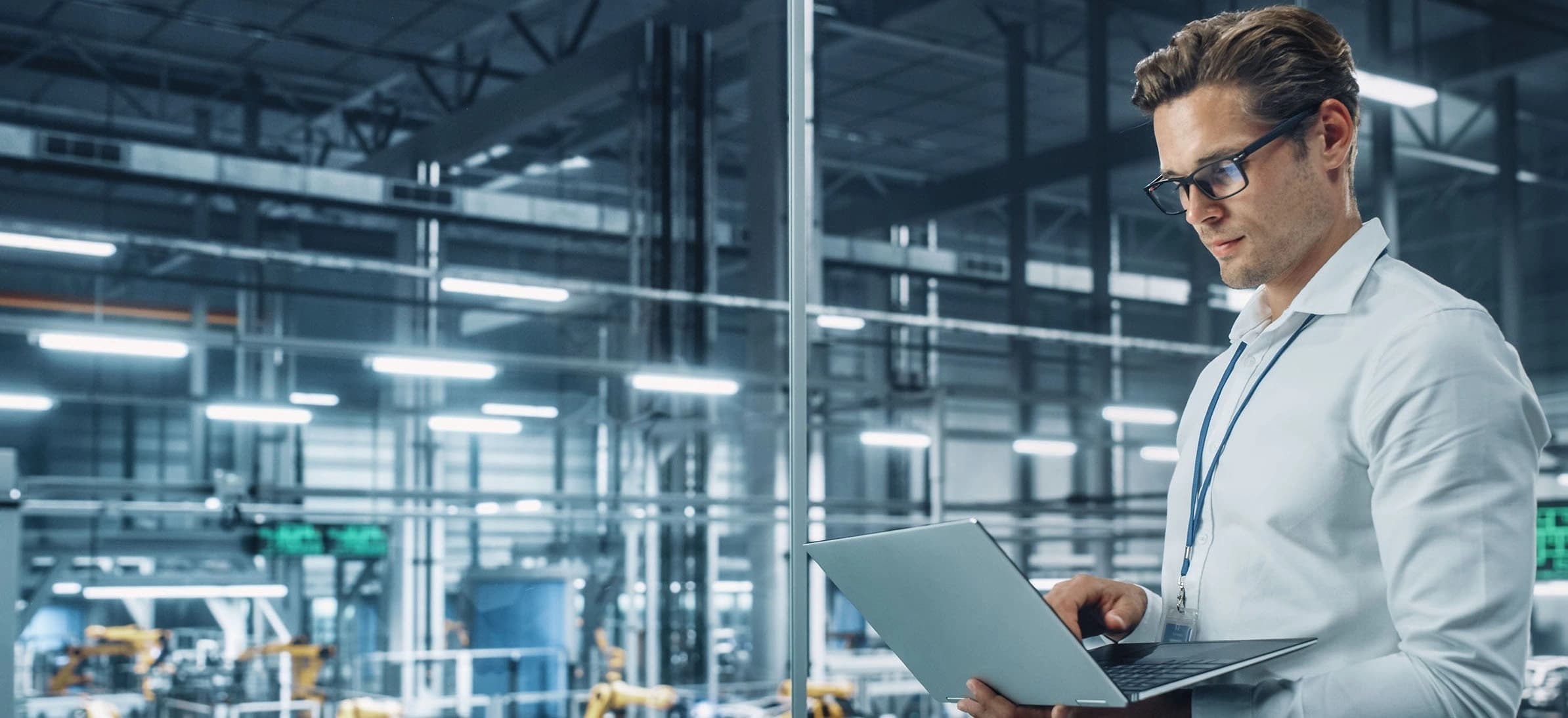 a men holding a computer