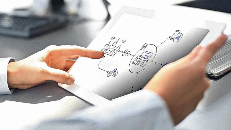 Mean holding a tablet with a plug & produce scheme.