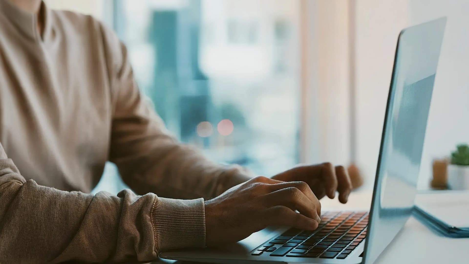 A person typing on a computer.