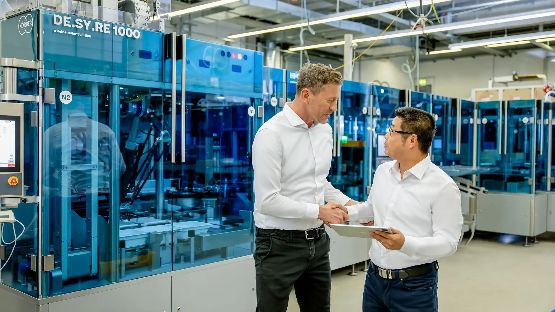 Two Körber Business Area Pharma shaking hands.