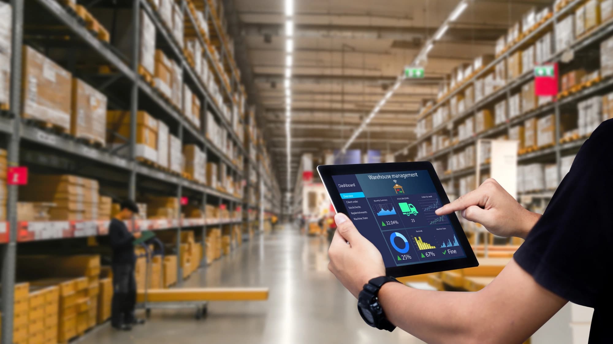 a man working on a table on a warehouse environment