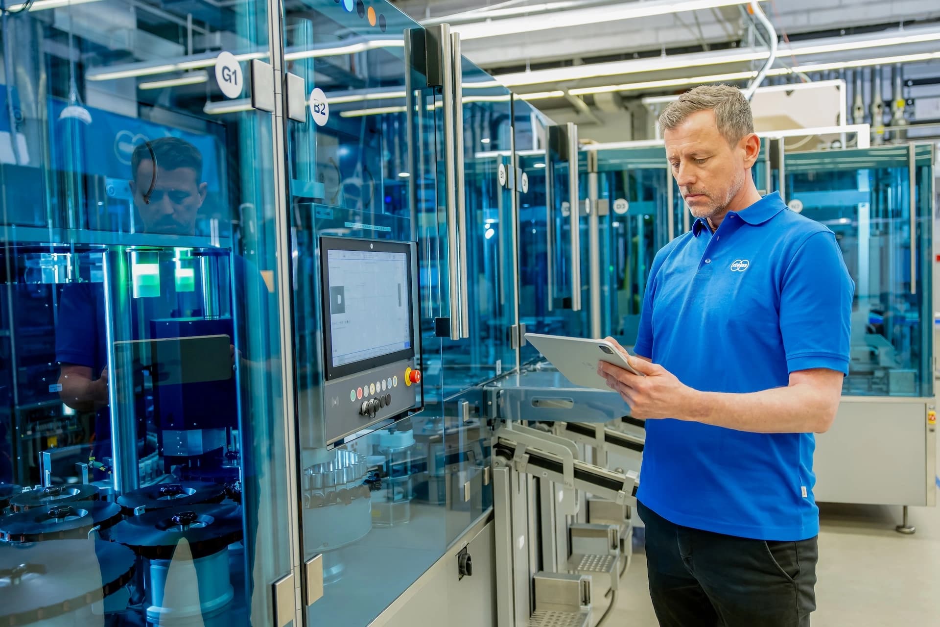 Employee using a tablet in a tech room.