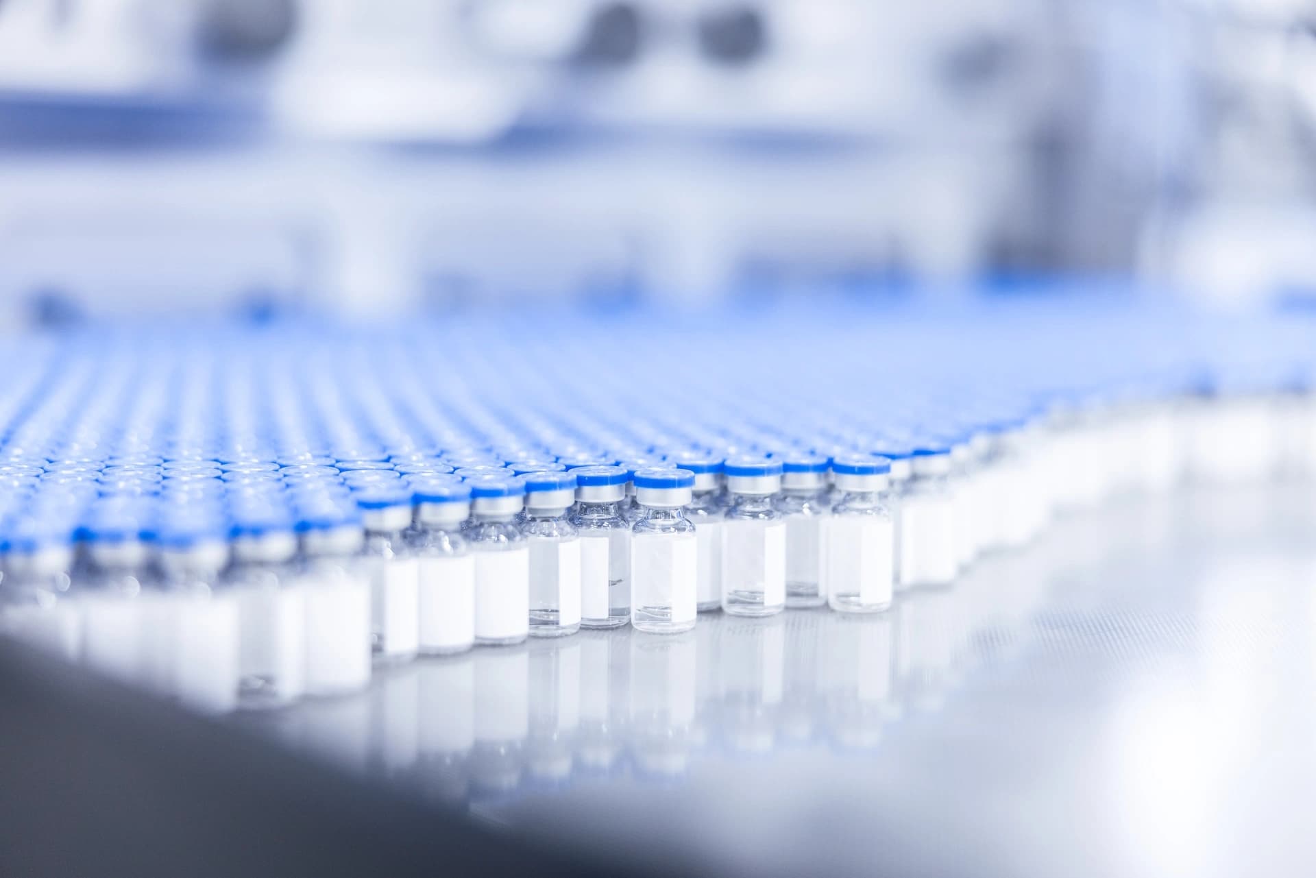 a table in a cleanroom full of vials