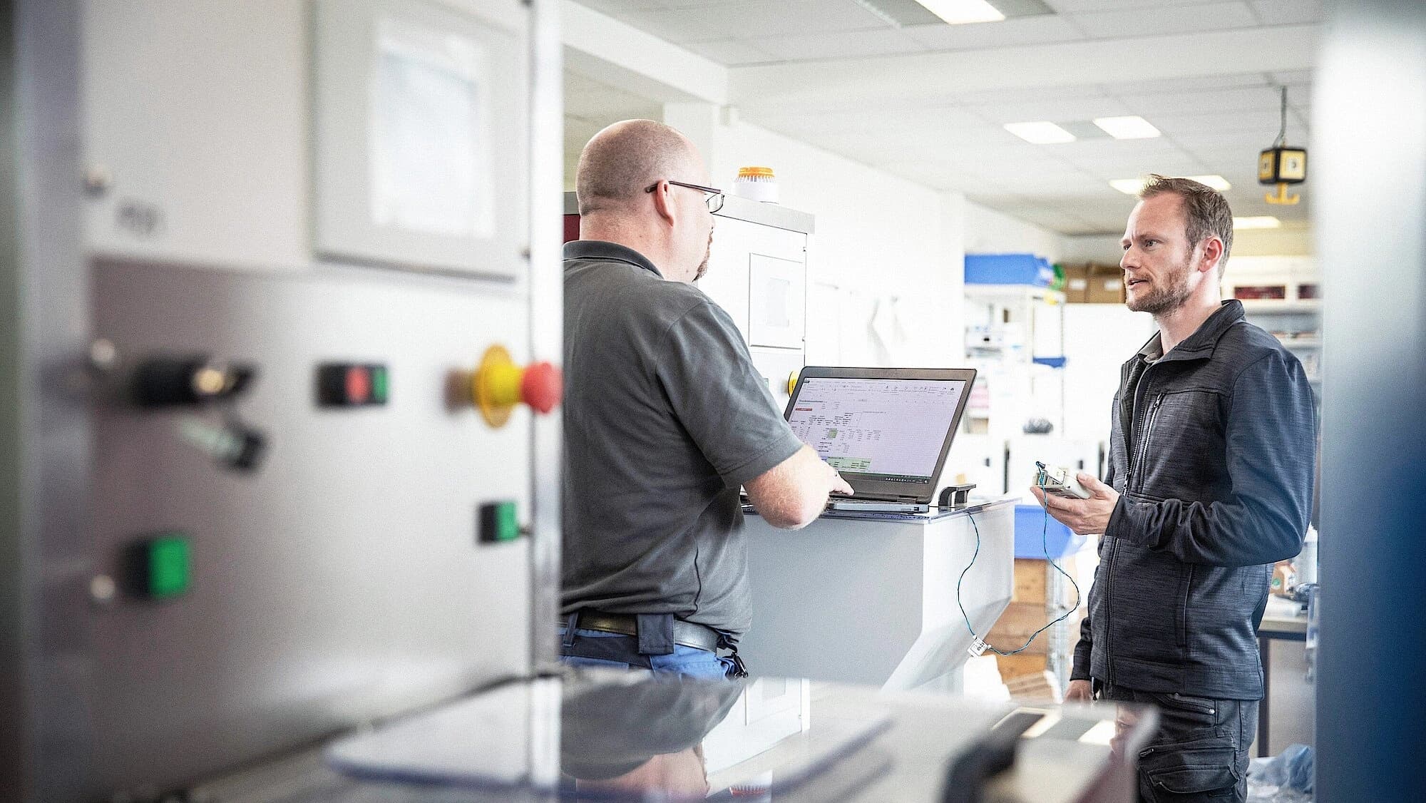 two Körber employees working