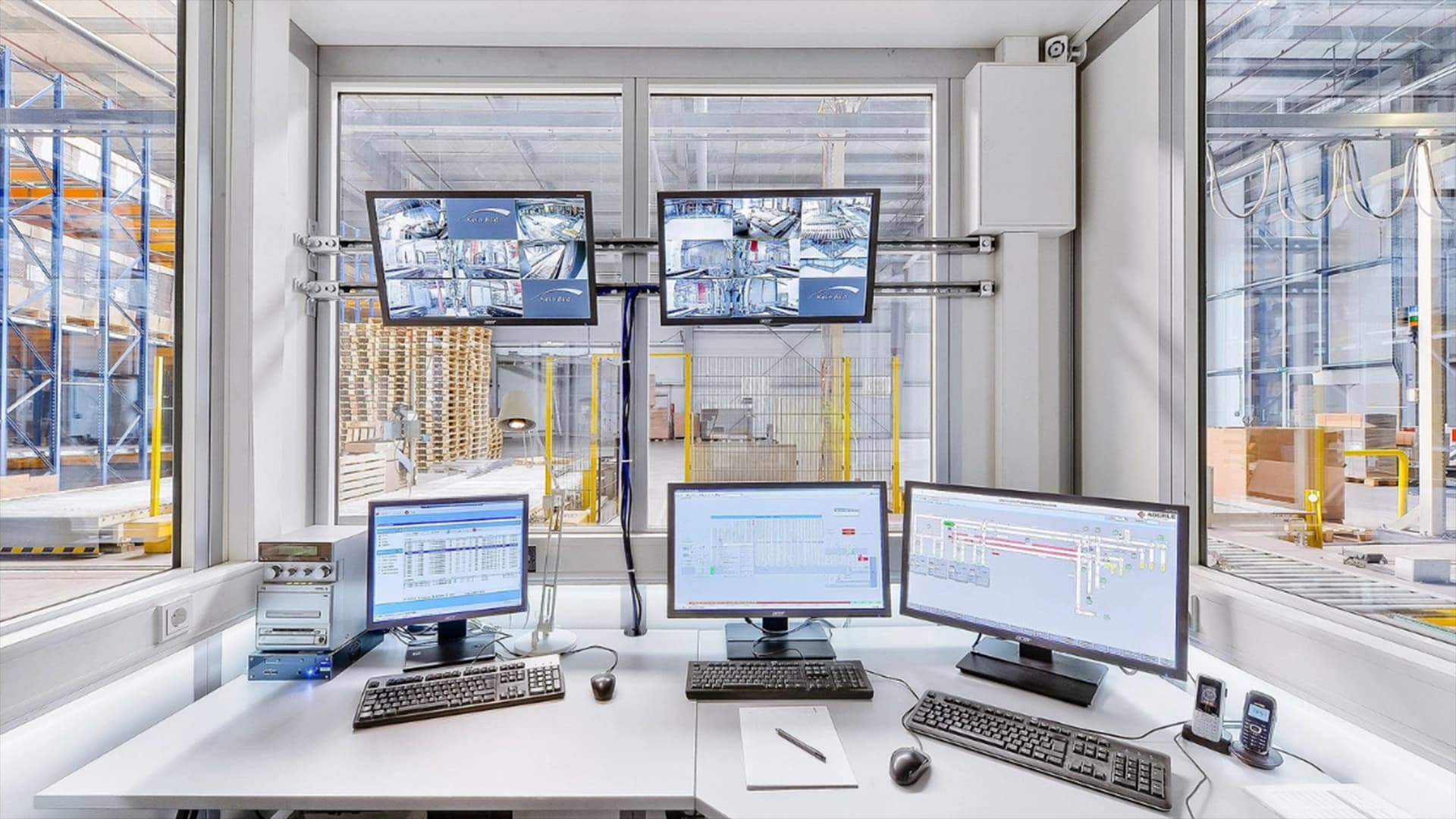 Image of a control room with Warehouse Control System.