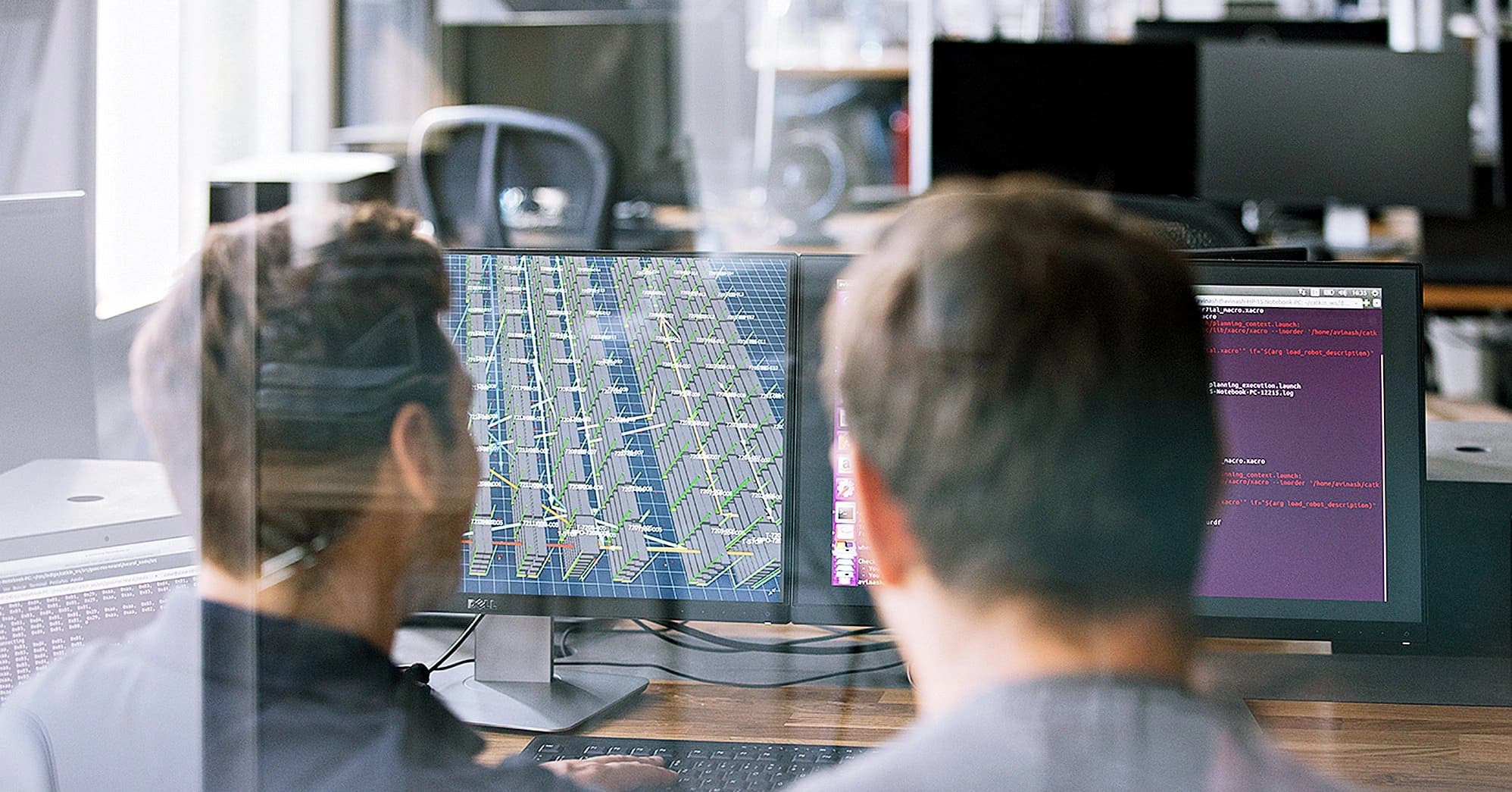 two Körber employees working on supply chian software