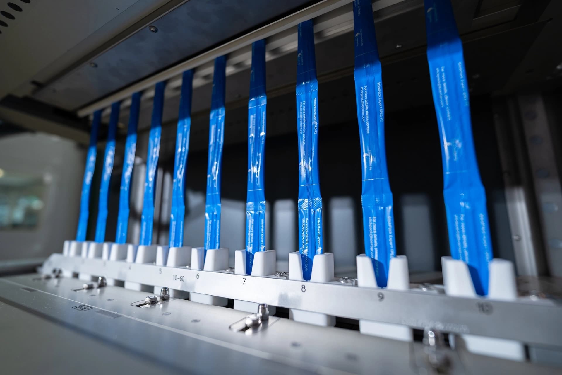 a bunch of sticks in a stickline packaging machine