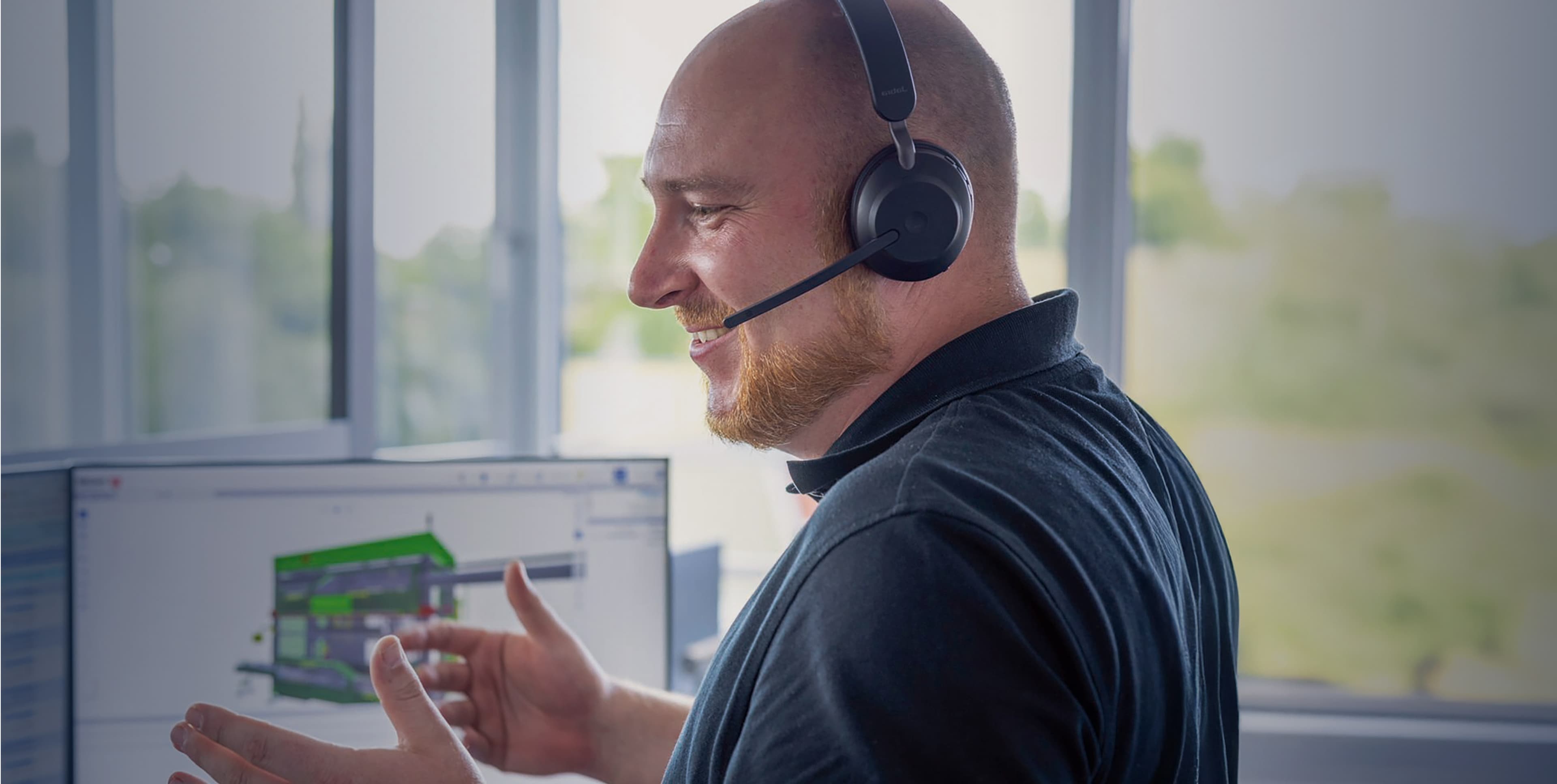 A man in a black shirt providing remote support