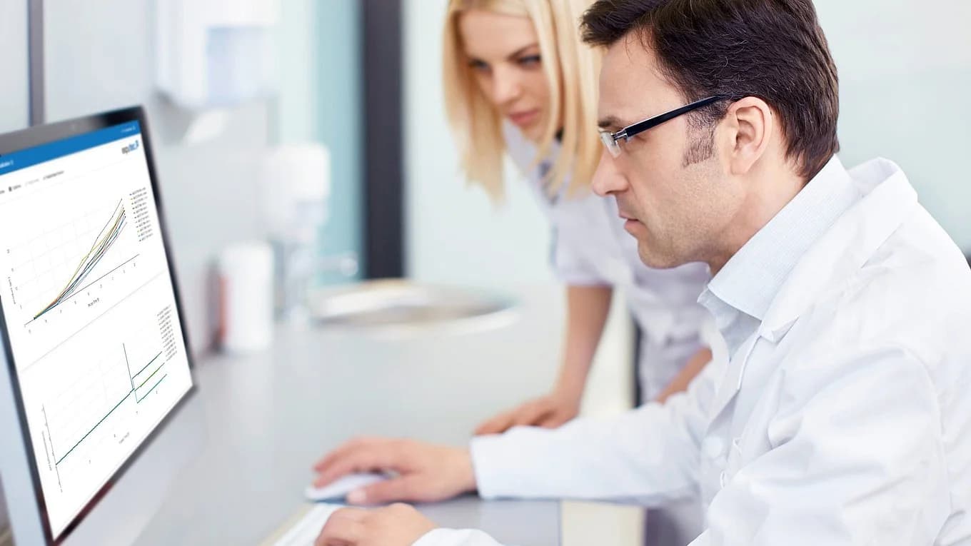 a man and a woman working on pas-x savvy