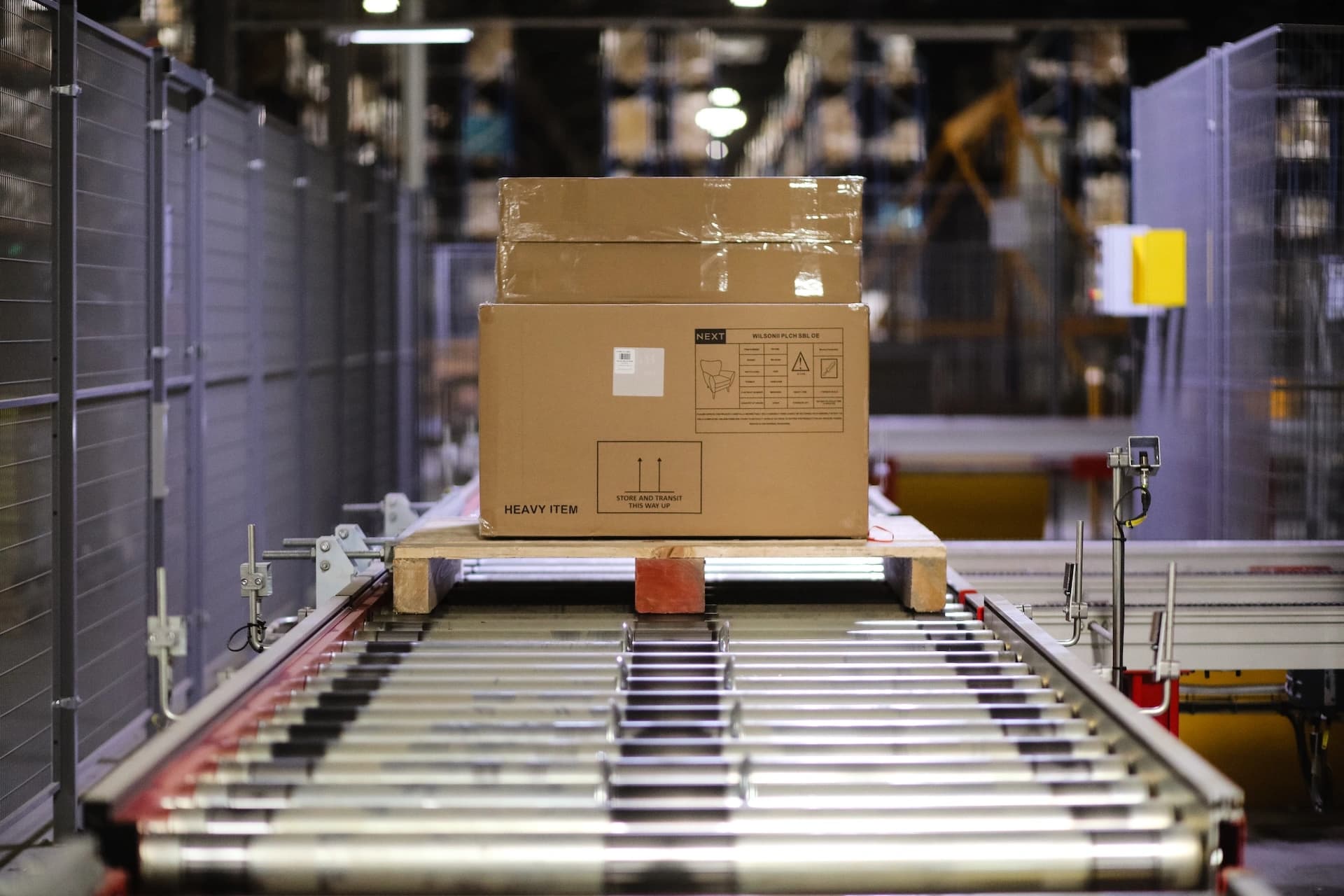 Pallets being handled in a warehouse.