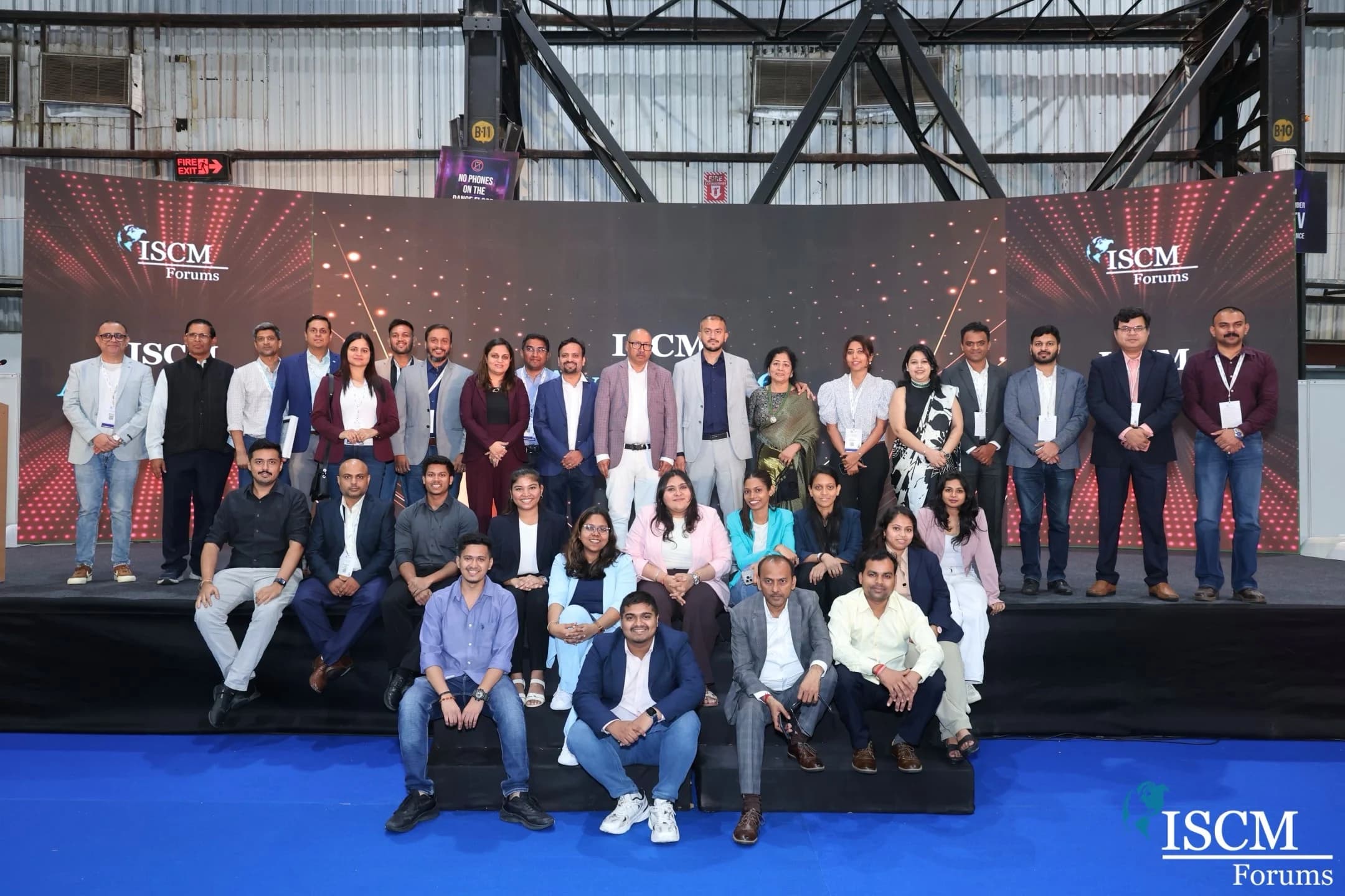 Group photo of event participants on stage at ISCM Awards 2026.