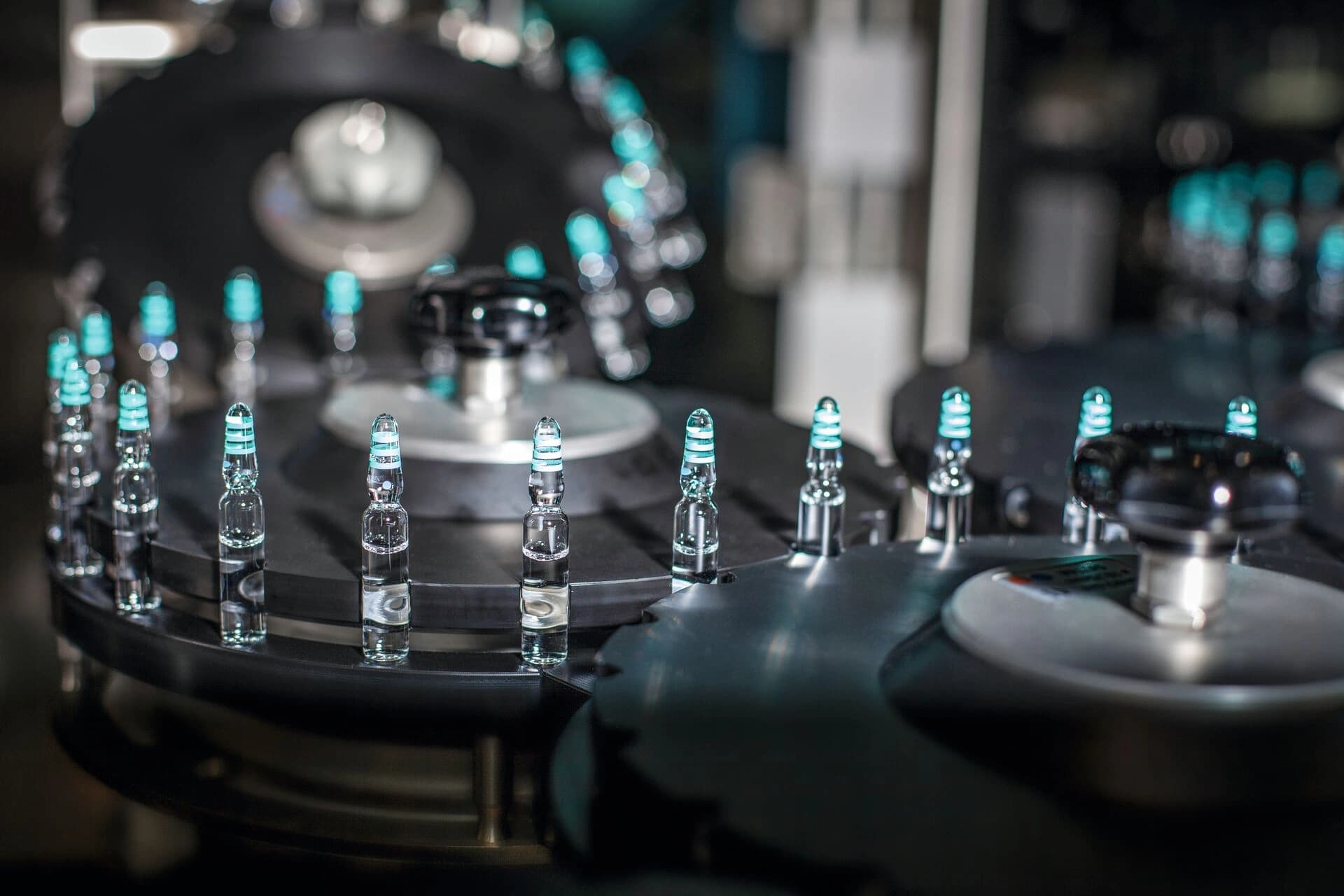 Picture of ampoules being inspected on a machine.