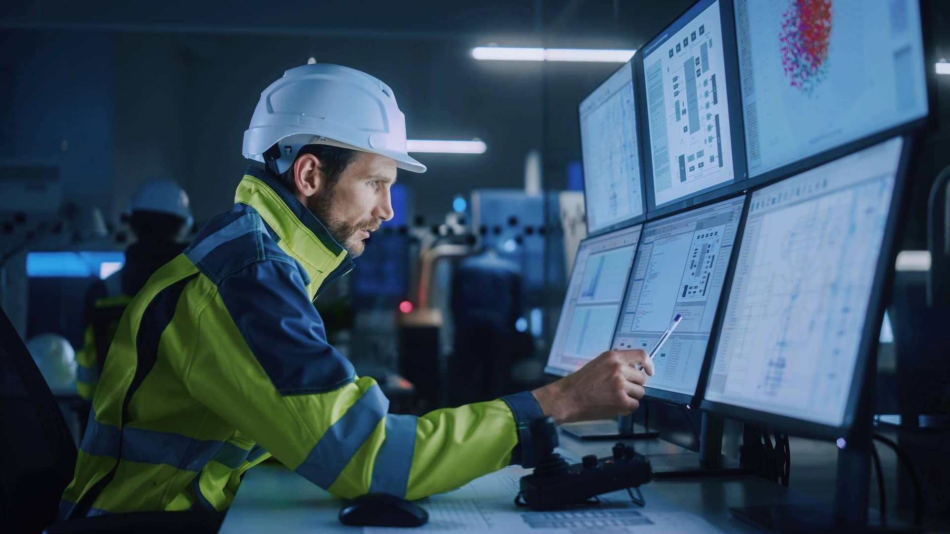 a Körber worker focused on a computer