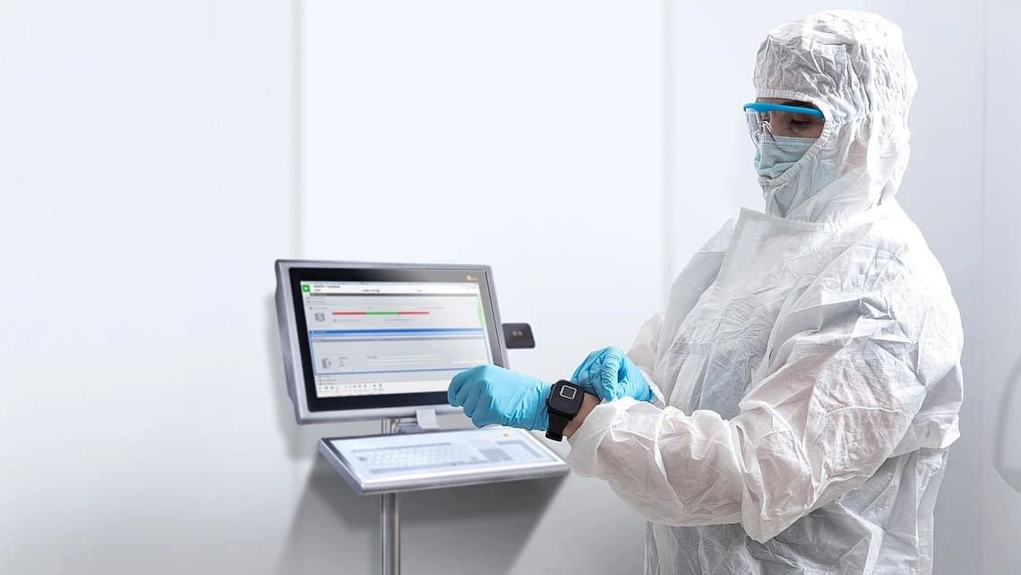 a woman in safety gear working on pas-x