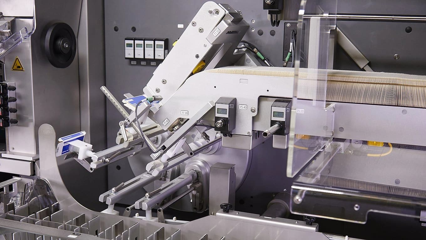Image of a K.Pak sideload and palletizer case packer.