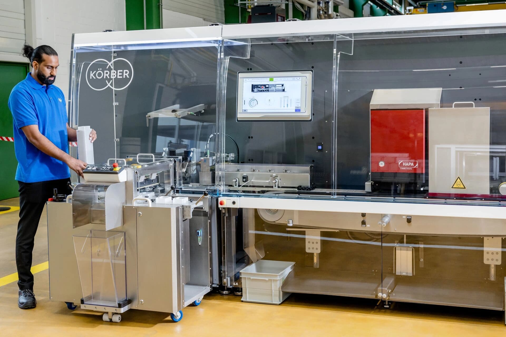a man using a late stage customization machine