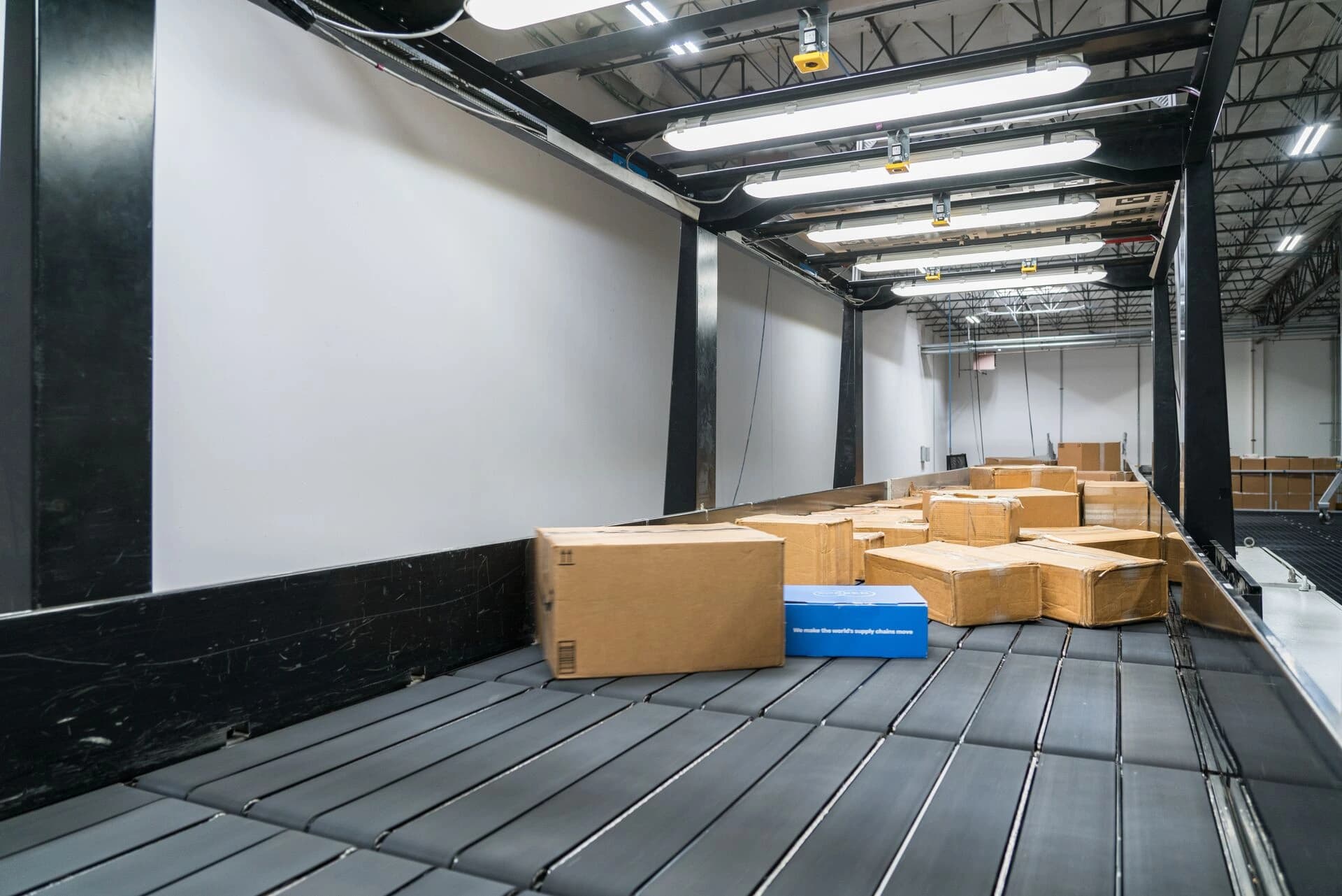 Singulation system in action with boxes being moved.