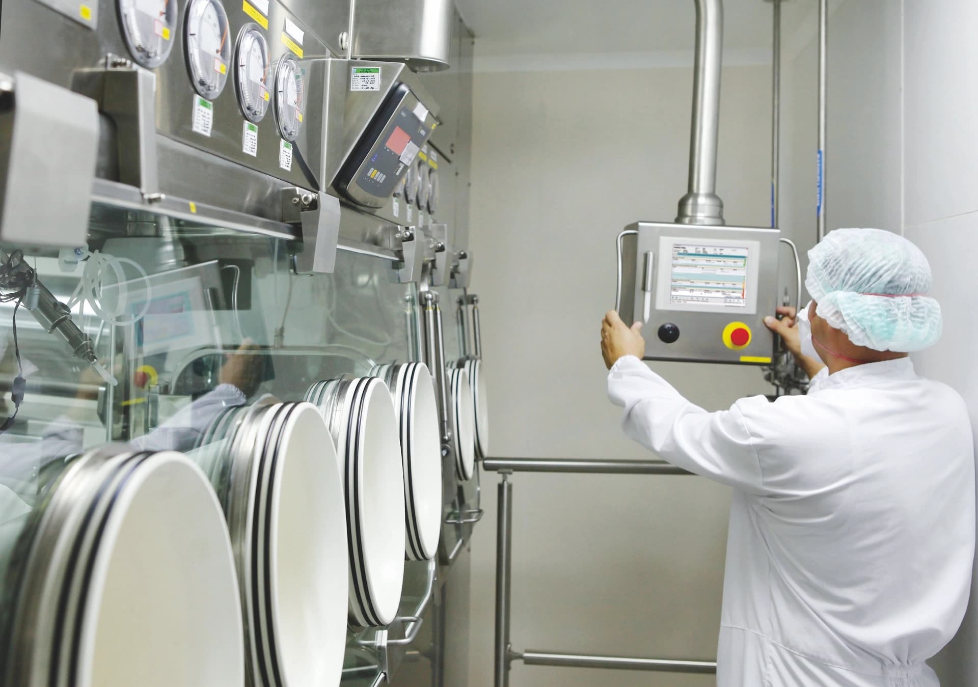 a Körber employee in a lab environment working on software implementation services