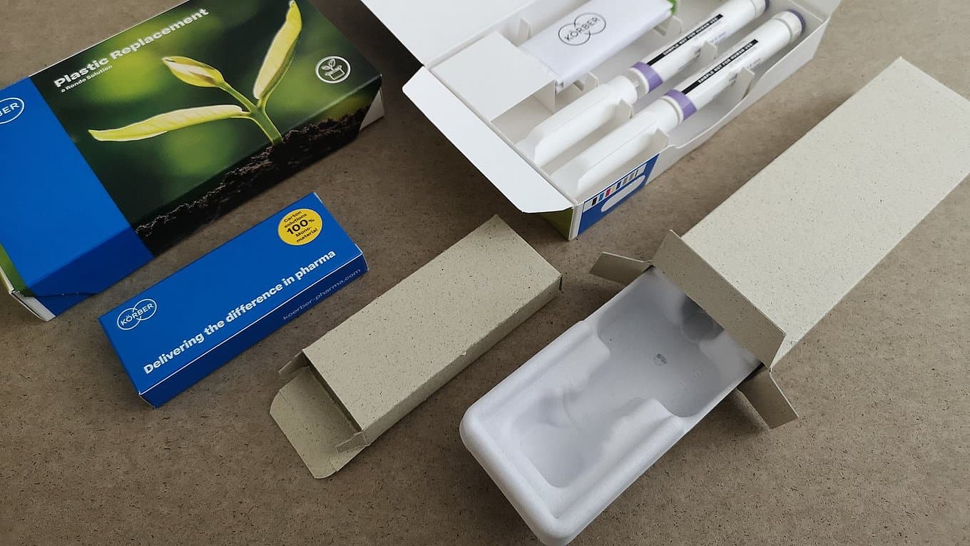 Monomaterial pharma packaging components from Körber, including eco-friendly cartons and molded fiber trays designed to reduce plastic use.