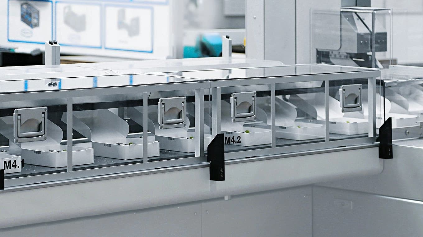 A factory machine with a conveyor belt, showcasing an industrial setting and automated production process