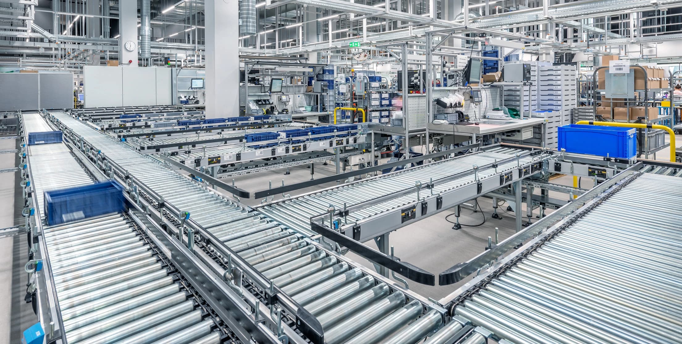 Binder's factory interior featuring multiple conveyor belts transporting goods along a streamlined production line.